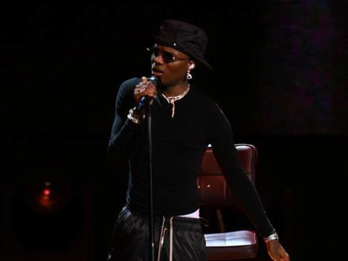 Wizkid performing live during his 2026 world tour, celebrating his record-breaking Spotify streaming milestone.